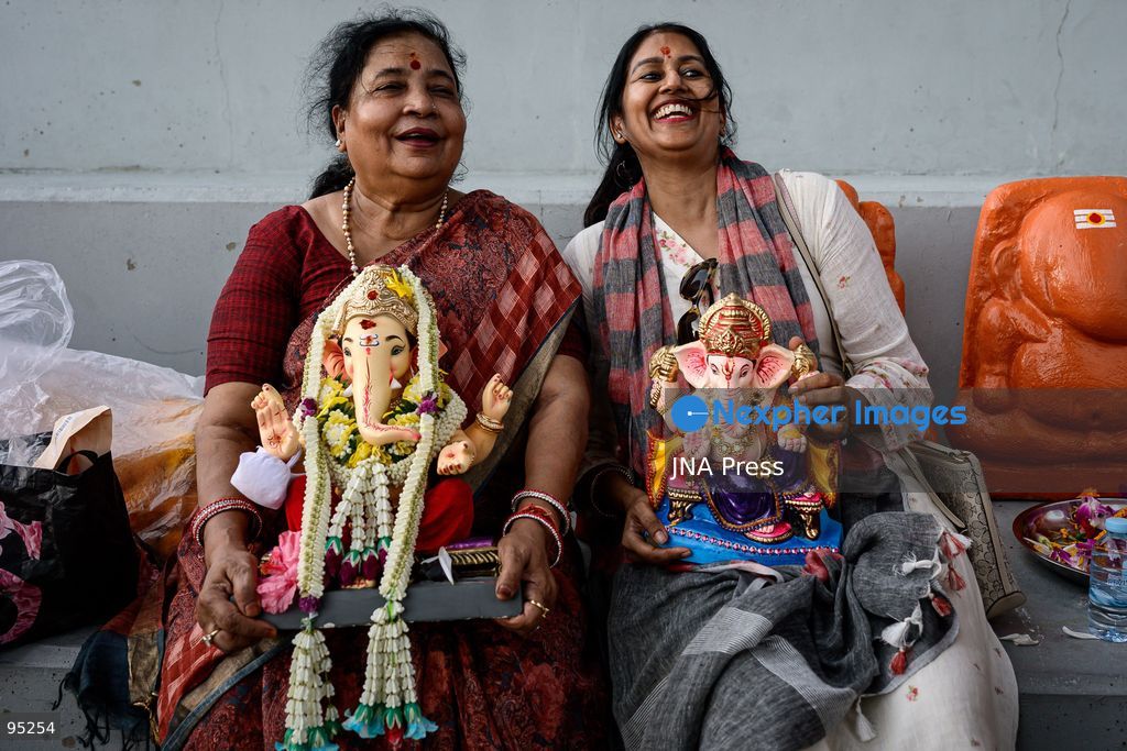BANGKOK, THAILAND, SEPTEMBER 20, 2026: Hindu devotees worship a statue of Lord Ganesha during Ganesh Chaturthi celebrations near Bhumibol Bridge in Bangkok. The Hindu festival honors Ganesha, the deity associated with wisdom, prosperity and the removal of obstacles, and is observed with prayers, offerings and religious ceremonies. Photo by Watsawat Koktabtim / JNA Press. (Photo by Watsawat Koktabtim/JNA Press via Nexpher Images)