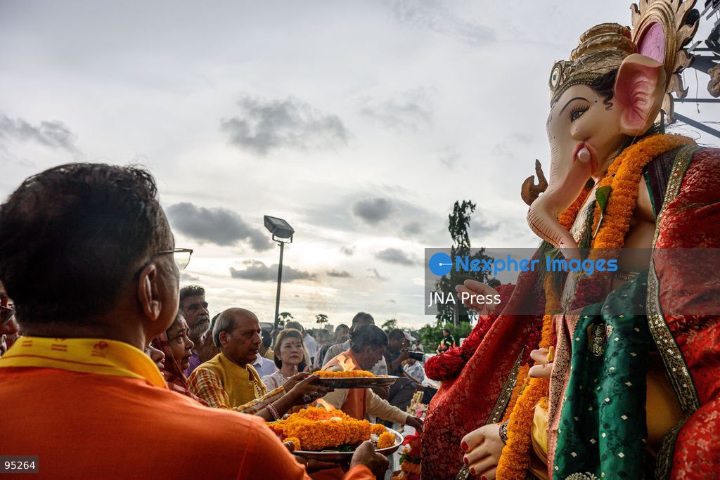 BANGKOK, THAILAND, SEPTEMBER 20, 2026: Hindu devotees worship a statue of Lord Ganesha during Ganesh Chaturthi celebrations near Bhumibol Bridge in Bangkok. The Hindu festival honors Ganesha, the deity associated with wisdom, prosperity and the removal of obstacles, and is observed with prayers, offerings and religious ceremonies. Photo by Watsawat Koktabtim / JNA Press. (Photo by Watsawat Koktabtim/JNA Press via Nexpher Images)