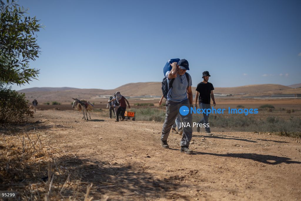 RAS AL-AHMAR, TUBAS, OCCUPIED WEST BANK, SEPTEMBER 20, 2026: Solidarity activists deliver food and water supplies to Palestinian residents of Ras al-Ahmar, southeast of Tubas, as Israeli forces continue to restrict access to the community by closing entrances and digging trenches. The area has seen months of earthworks linked to the construction of a military road planned to extend about 22 kilometers between the Ein Shibli and Tayasir checkpoints. Local officials say previous earthworks have damaged water infrastructure and restricted residents’ access to their land and livelihoods. Photo by Roman Levin / JNA Press. (Photo by Roman Levin/JNA Press via Nexpher Images)
