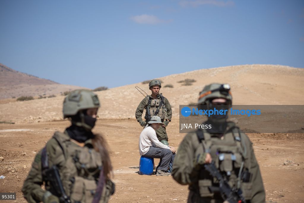 RAS AL-AHMAR, TUBAS, OCCUPIED WEST BANK, SEPTEMBER 20, 2026: Solidarity activists deliver food and water supplies to Palestinian residents of Ras al-Ahmar, southeast of Tubas, as Israeli forces continue to restrict access to the community by closing entrances and digging trenches. The area has seen months of earthworks linked to the construction of a military road planned to extend about 22 kilometers between the Ein Shibli and Tayasir checkpoints. Local officials say previous earthworks have damaged water infrastructure and restricted residents’ access to their land and livelihoods. Photo by Roman Levin / JNA Press. (Photo by Roman Levin/JNA Press via Nexpher Images)