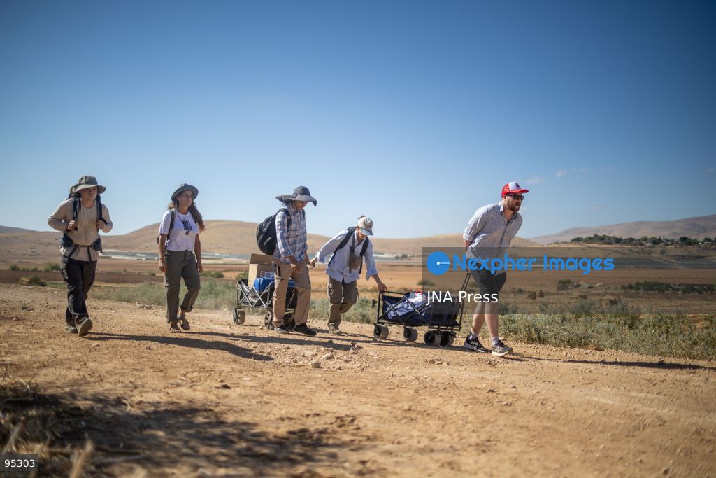 RAS AL-AHMAR, TUBAS, OCCUPIED WEST BANK, SEPTEMBER 20, 2026: Solidarity activists deliver food and water supplies to Palestinian residents of Ras al-Ahmar, southeast of Tubas, as Israeli forces continue to restrict access to the community by closing entrances and digging trenches. The area has seen months of earthworks linked to the construction of a military road planned to extend about 22 kilometers between the Ein Shibli and Tayasir checkpoints. Local officials say previous earthworks have damaged water infrastructure and restricted residents’ access to their land and livelihoods. Photo by Roman Levin / JNA Press. (Photo by Roman Levin/JNA Press via Nexpher Images)