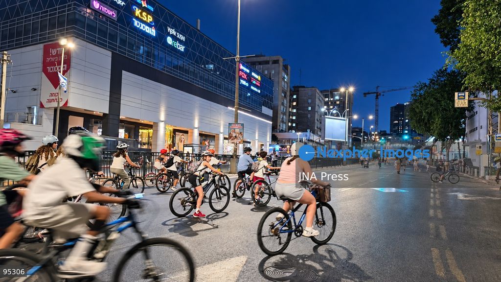 RAMAT GAN, ISRAEL, SEPTEMBER 20, 2026: Israelis ride bicycles, scooters and skateboards along largely empty streets in Ramat Gan as Yom Kippur begins at sunset. Motor traffic largely comes to a halt during the Jewish Day of Atonement, while worshippers attend synagogue services and observe a 25-hour period of fasting and prayer. The absence of regular traffic has also led many children and families to use the streets for cycling and other wheeled activities during the holiday. Photo by Paulina Patimer / JNA Press. (Photo by Paulina Patimer/JNA Press via Nexpher Images)
