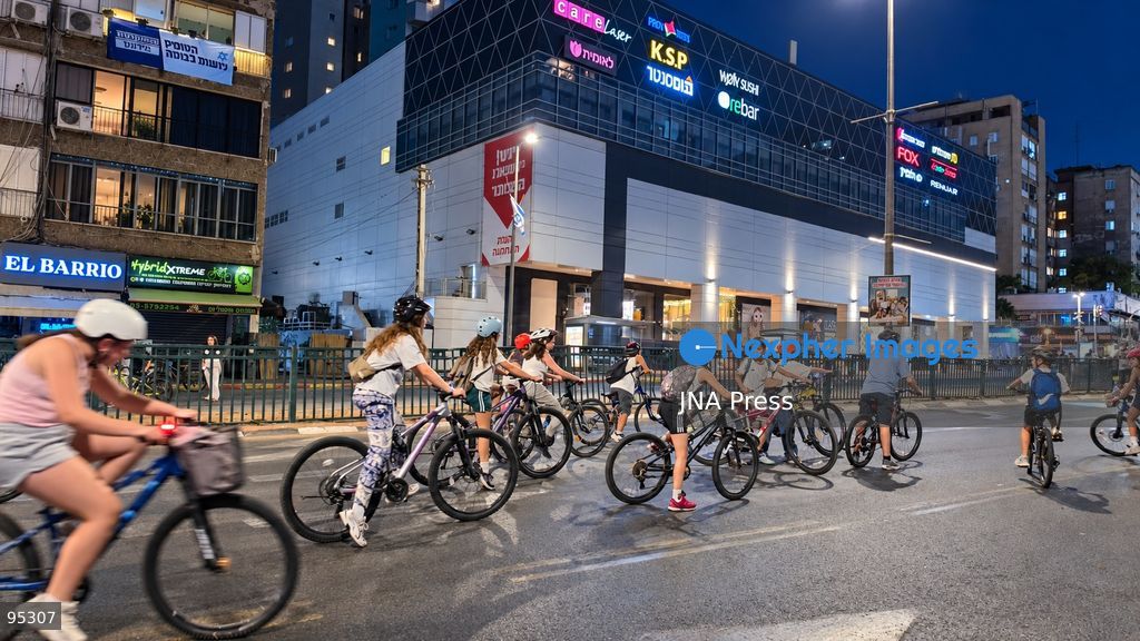 RAMAT GAN, ISRAEL, SEPTEMBER 20, 2026: Israelis ride bicycles, scooters and skateboards along largely empty streets in Ramat Gan as Yom Kippur begins at sunset. Motor traffic largely comes to a halt during the Jewish Day of Atonement, while worshippers attend synagogue services and observe a 25-hour period of fasting and prayer. The absence of regular traffic has also led many children and families to use the streets for cycling and other wheeled activities during the holiday. Photo by Paulina Patimer / JNA Press. (Photo by Paulina Patimer/JNA Press via Nexpher Images)