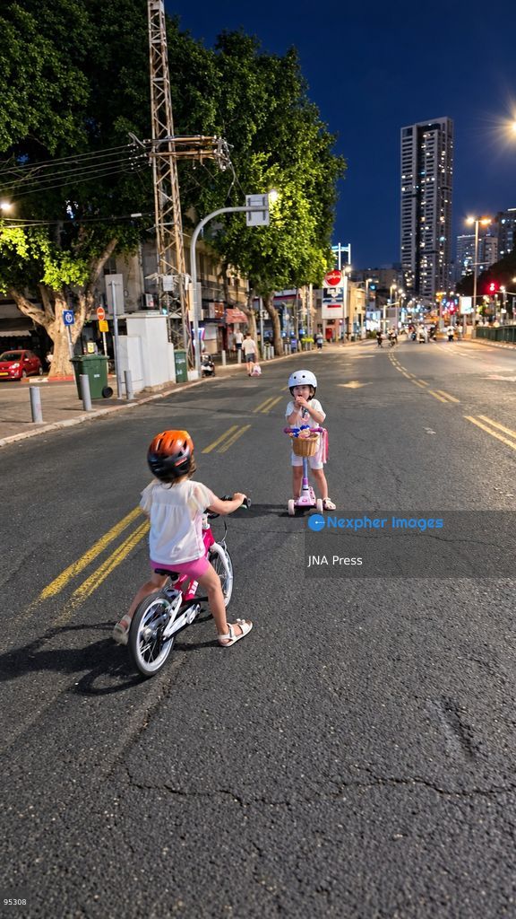 RAMAT GAN, ISRAEL, SEPTEMBER 20, 2026: Israelis ride bicycles, scooters and skateboards along largely empty streets in Ramat Gan as Yom Kippur begins at sunset. Motor traffic largely comes to a halt during the Jewish Day of Atonement, while worshippers attend synagogue services and observe a 25-hour period of fasting and prayer. The absence of regular traffic has also led many children and families to use the streets for cycling and other wheeled activities during the holiday. Photo by Paulina Patimer / JNA Press. (Photo by Paulina Patimer/JNA Press via Nexpher Images)