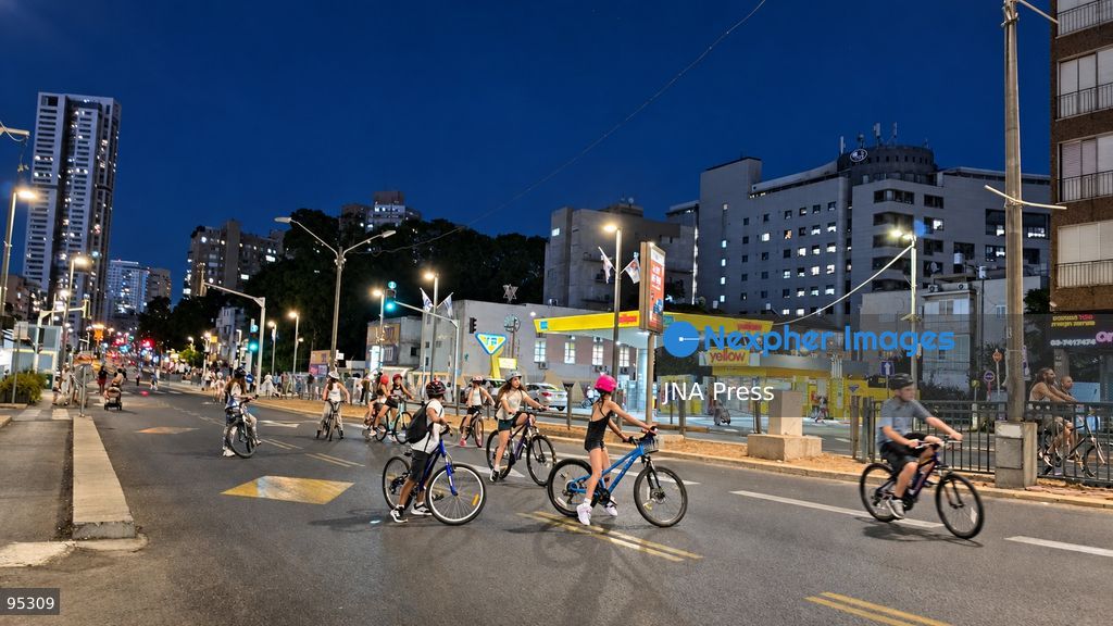 RAMAT GAN, ISRAEL, SEPTEMBER 20, 2026: Israelis ride bicycles, scooters and skateboards along largely empty streets in Ramat Gan as Yom Kippur begins at sunset. Motor traffic largely comes to a halt during the Jewish Day of Atonement, while worshippers attend synagogue services and observe a 25-hour period of fasting and prayer. The absence of regular traffic has also led many children and families to use the streets for cycling and other wheeled activities during the holiday. Photo by Paulina Patimer / JNA Press. (Photo by Paulina Patimer/JNA Press via Nexpher Images)