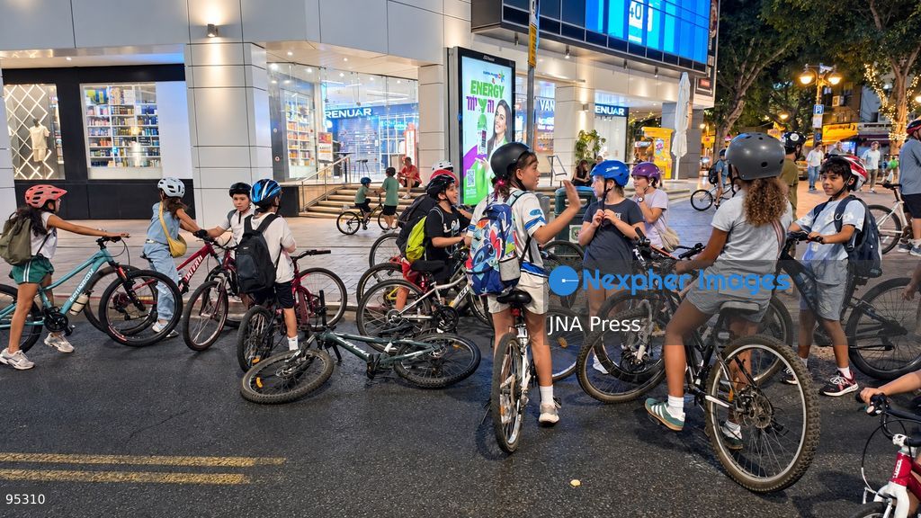 RAMAT GAN, ISRAEL, SEPTEMBER 20, 2026: Israelis ride bicycles, scooters and skateboards along largely empty streets in Ramat Gan as Yom Kippur begins at sunset. Motor traffic largely comes to a halt during the Jewish Day of Atonement, while worshippers attend synagogue services and observe a 25-hour period of fasting and prayer. The absence of regular traffic has also led many children and families to use the streets for cycling and other wheeled activities during the holiday. Photo by Paulina Patimer / JNA Press. (Photo by Paulina Patimer/JNA Press via Nexpher Images)