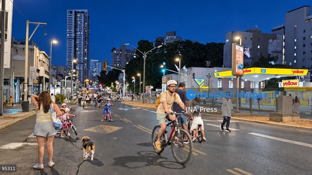 RAMAT GAN, ISRAEL, SEPTEMBER 20, 2026: Israelis ride bicycles, scooters and skateboards along largely empty streets in Ramat Gan as Yom Kippur begins at sunset. Motor traffic largely comes to a halt during the Jewish Day of Atonement, while worshippers attend synagogue services and observe a 25-hour period of fasting and prayer. The absence of regular traffic has also led many children and families to use the streets for cycling and other wheeled activities during the holiday. Photo by Paulina Patimer / JNA Press. (Photo by Paulina Patimer/JNA Press via Nexpher Images)