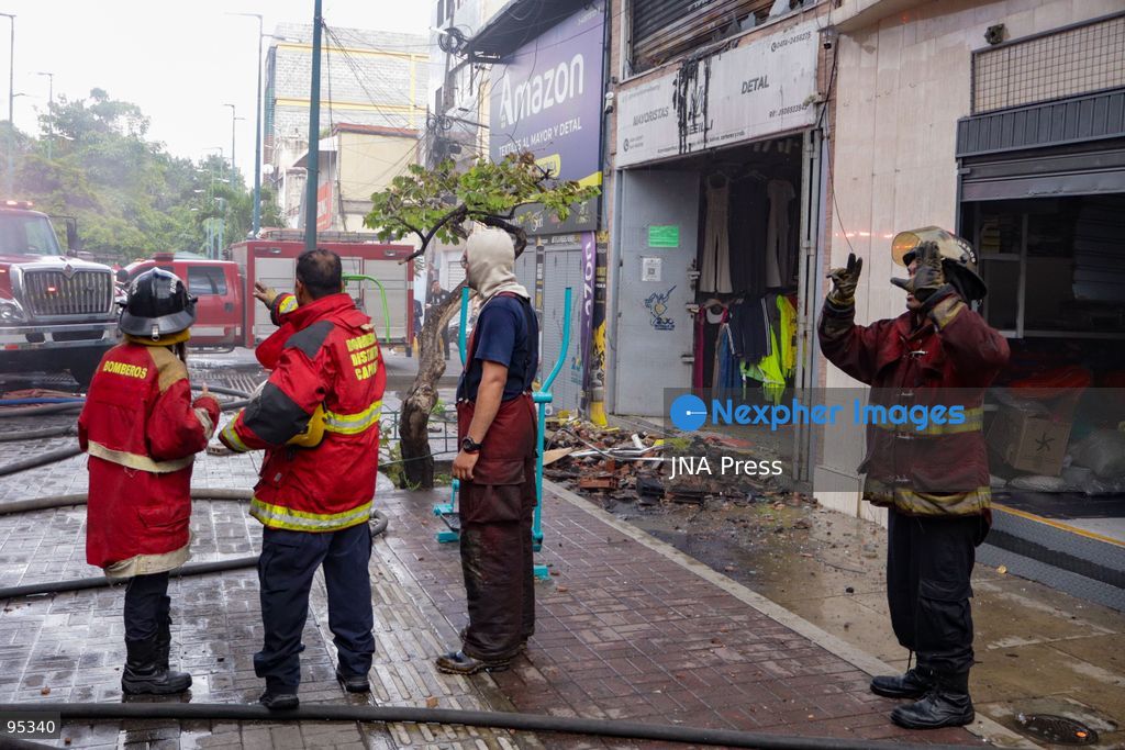 CARACAS, VENEZUELA, SEPTEMBER 20, 2026: Firefighters work at the scene of a fire that damaged a three-story commercial building housing the Meiliwang textile and footwear store on Avenida Principal de El Cementerio in Caracas’ Libertador municipality. Caracas firefighters, Civil Protection teams, UCV firefighters and municipal emergency personnel responded to extinguish the blaze and carry out cooling operations. No injuries were reported, while authorities are investigating the cause of the fire. Photo by Mario Flores / JNA Press. (Photo by Mario Flores/JNA Press via Nexpher Images)