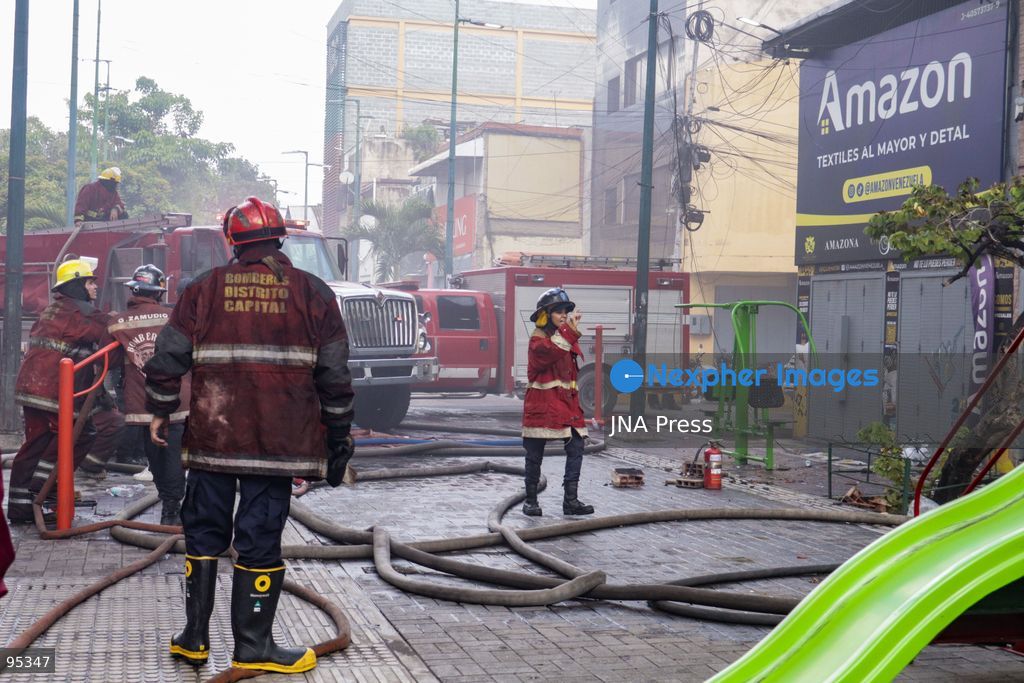CARACAS, VENEZUELA, SEPTEMBER 20, 2026: Firefighters work at the scene of a fire that damaged a three-story commercial building housing the Meiliwang textile and footwear store on Avenida Principal de El Cementerio in Caracas’ Libertador municipality. Caracas firefighters, Civil Protection teams, UCV firefighters and municipal emergency personnel responded to extinguish the blaze and carry out cooling operations. No injuries were reported, while authorities are investigating the cause of the fire. Photo by Mario Flores / JNA Press. (Photo by Mario Flores/JNA Press via Nexpher Images)
