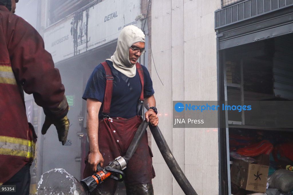 CARACAS, VENEZUELA, SEPTEMBER 20, 2026: Firefighters work at the scene of a fire that damaged a three-story commercial building housing the Meiliwang textile and footwear store on Avenida Principal de El Cementerio in Caracas’ Libertador municipality. Caracas firefighters, Civil Protection teams, UCV firefighters and municipal emergency personnel responded to extinguish the blaze and carry out cooling operations. No injuries were reported, while authorities are investigating the cause of the fire. Photo by Mario Flores / JNA Press. (Photo by Mario Flores/JNA Press via Nexpher Images)
