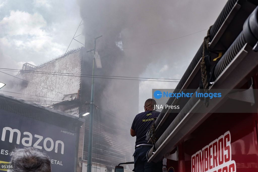 CARACAS, VENEZUELA, SEPTEMBER 20, 2026: Firefighters work at the scene of a fire that damaged a three-story commercial building housing the Meiliwang textile and footwear store on Avenida Principal de El Cementerio in Caracas’ Libertador municipality. Caracas firefighters, Civil Protection teams, UCV firefighters and municipal emergency personnel responded to extinguish the blaze and carry out cooling operations. No injuries were reported, while authorities are investigating the cause of the fire. Photo by Mario Flores / JNA Press. (Photo by Mario Flores/JNA Press via Nexpher Images)
