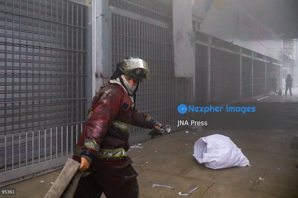 CARACAS, VENEZUELA, SEPTEMBER 20, 2026: Firefighters work at the scene of a fire that damaged a three-story commercial building housing the Meiliwang textile and footwear store on Avenida Principal de El Cementerio in Caracas’ Libertador municipality. Caracas firefighters, Civil Protection teams, UCV firefighters and municipal emergency personnel responded to extinguish the blaze and carry out cooling operations. No injuries were reported, while authorities are investigating the cause of the fire. Photo by Mario Flores / JNA Press. (Photo by Mario Flores/JNA Press via Nexpher Images)