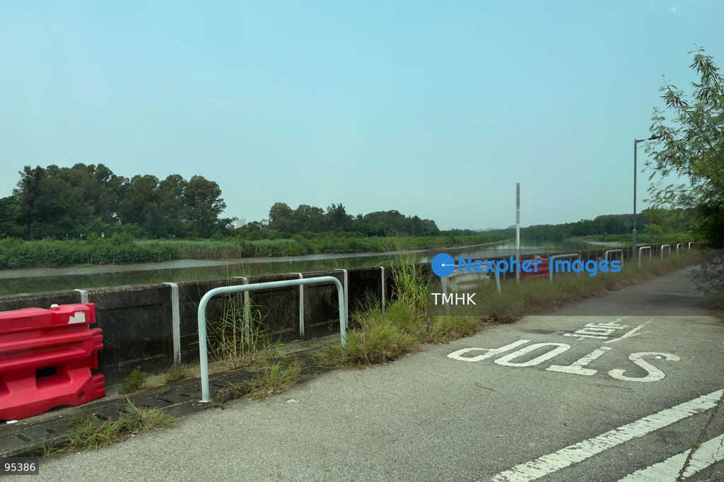 A general view shows the area along Pok Wai South Road in Yuen Long on September 21, 2026 in Hong Kong, where a 27-year-old woman died after being chased and fatally attacked by dogs while riding a shared bicycle. A joint operation involving police and the Agriculture, Fisheries and Conservation Department deployed drones and captured three adult mongrels in the vicinity for observation. (Photo by Kevin Li/TMHK via Nexpher Images)