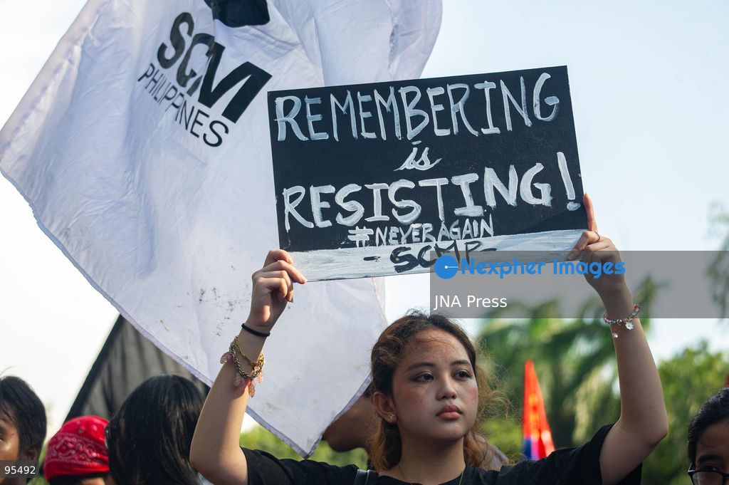 MANILA, PHILIPPINES, SEPTEMBER 21, 2026: Activists and members of progressive groups march through Manila during a demonstration marking the 54th anniversary of the declaration of Martial Law under former President Ferdinand Marcos Sr. The protest began with a program at Liwasang Bonifacio before demonstrators marched toward Mendiola, where police barricades had been deployed. Participants commemorated victims of human rights violations during the Marcos era and called for government accountability over current political and corruption issues. Photo by Charles Edmon / JNA Press. (Photo by Charles Edmon S. Perez/JNA Press via Nexpher Images)