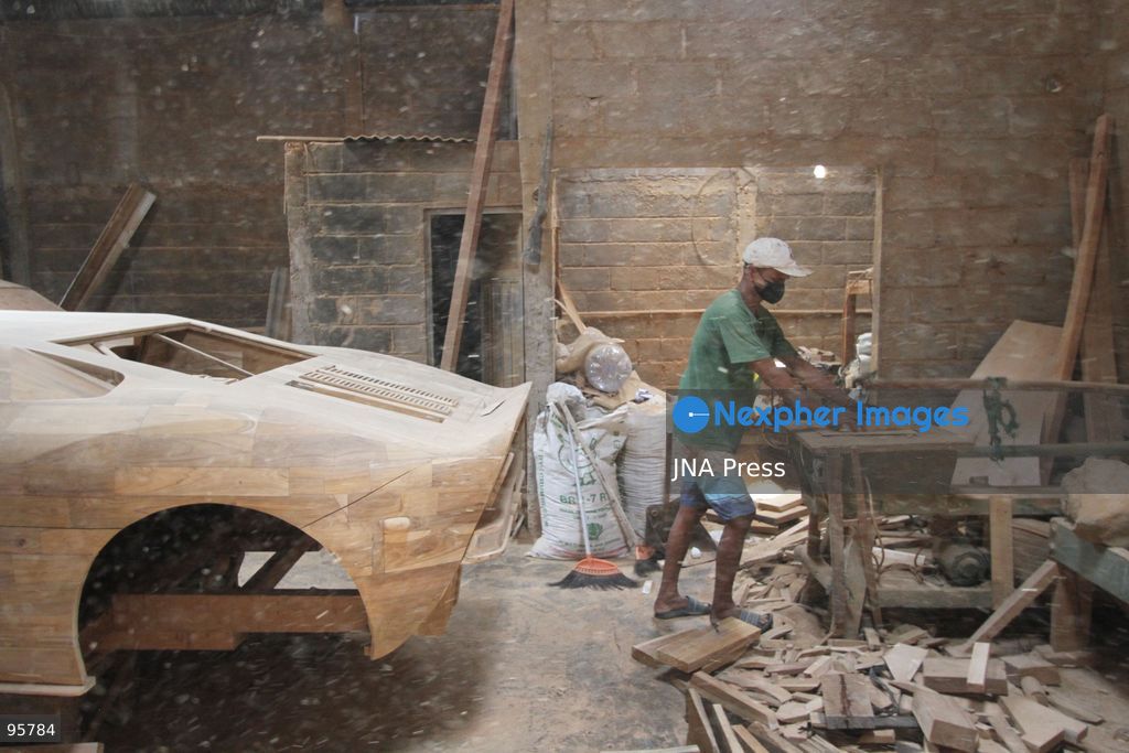 BOYOLALI, INDONESIA — SEPTEMBER 22, 2026: A worker applies a layer of varnish to a 1:1 scale wooden car and Harley-Davidson replica made from teak wood at Tetap Jaya Art Industrial House in Kemiri Village, Mojosongo District, Boyolali Regency, Central Java. The 1:1 scale vehicles take approximately one and a half months to complete, while smaller models take about two weeks. The products are ordered by buyers from several European countries at prices reaching tens of millions of rupiah. Mercedes-Benz, Renault, Ford, and Volkswagen cars, as well as Harley-Davidson and Vespa motorcycles, are among the customers' favorite models in European countries. Photo by Agung Mardika / JNA Press. (Photo by JNA EDITOR/JNA Press via Nexpher Images)