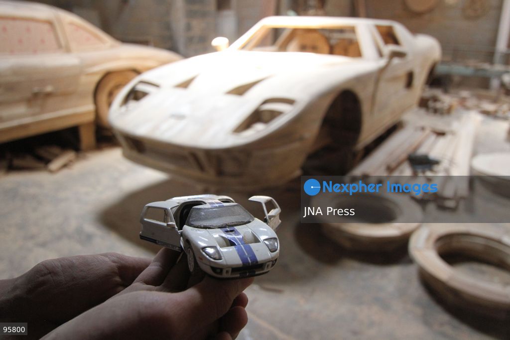 BOYOLALI, INDONESIA — SEPTEMBER 22, 2026: A worker applies a layer of varnish to a 1:1 scale wooden car and Harley-Davidson replica made from teak wood at Tetap Jaya Art Industrial House in Kemiri Village, Mojosongo District, Boyolali Regency, Central Java. The 1:1 scale vehicles take approximately one and a half months to complete, while smaller models take about two weeks. The products are ordered by buyers from several European countries at prices reaching tens of millions of rupiah. Mercedes-Benz, Renault, Ford, and Volkswagen cars, as well as Harley-Davidson and Vespa motorcycles, are among the customers' favorite models in European countries. Photo by Agung Mardika / JNA Press. (Photo by JNA EDITOR/JNA Press via Nexpher Images)