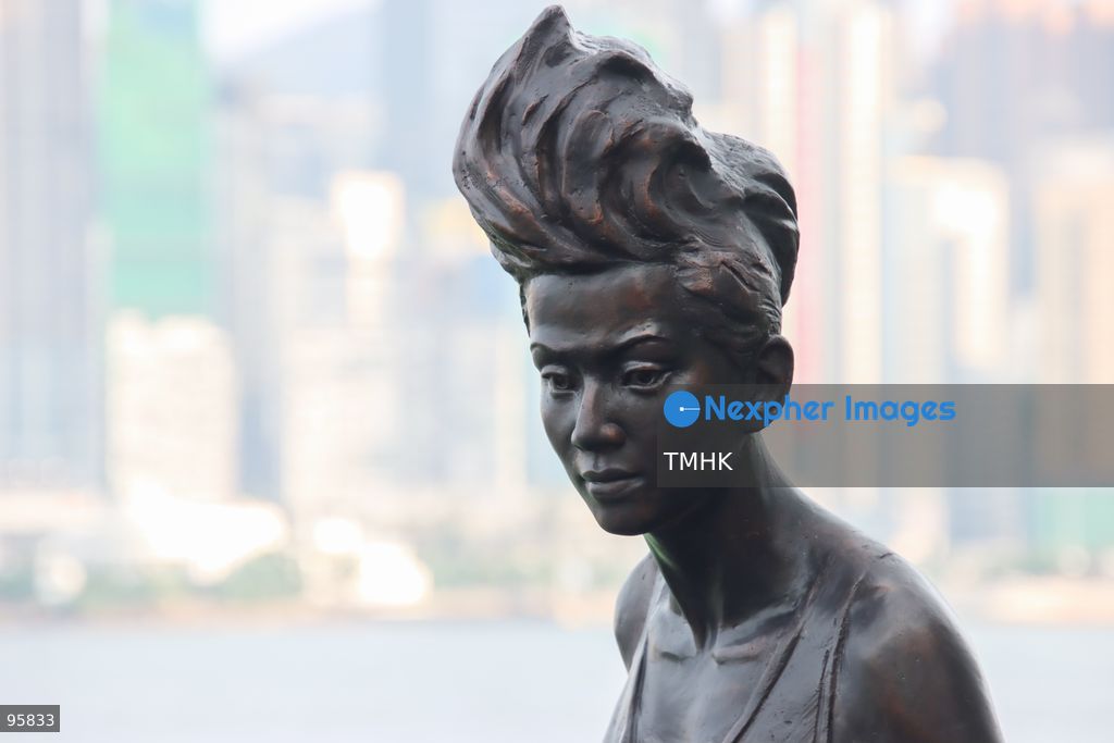 A close-up view shows the head and facial details of the restored bronze statue of the late Canto-pop icon Anita Mui at the Avenue of Stars on September 22, 2026 in Hong Kong. The monument underwent specialized restoration led by artist William Lim, treating heavy corrosion caused by long-term exposure to sea breeze along Victoria Harbour to recreate the singer's iconic expression and intricate features. (Photo by Gordon Choi/TMHK via Nexpher Images)