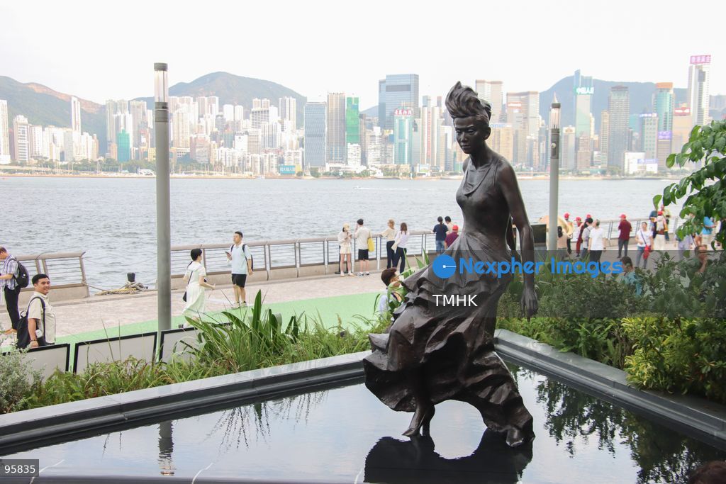 A general view shows the restored bronze statue of the late Canto-pop icon Anita Mui standing against the Victoria Harbour backdrop at the Avenue of Stars in Tsim Sha Tsui on September 22, 2026 in Hong Kong. The monument, dedicated to the "Daughter of Hong Kong", was unveiled anew following extensive conservation work to treat corrosion caused by long-term sea-spray exposure. (Photo by Gordon Choi/TMHK via Nexpher Images)