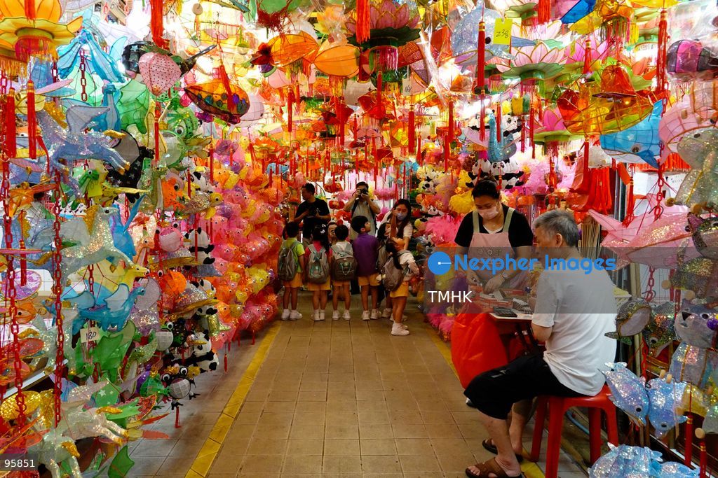Children look up in delight at a ceiling filled with traditional handmade paper lanterns and colourful plastic lanterns during a visit to an old shop on September 22, 2026 in Hong Kong, discovering classic festive customs ahead of the Mid-Autumn Festival. (Photo by Zulu Lo/TMHK via Nexpher Images)