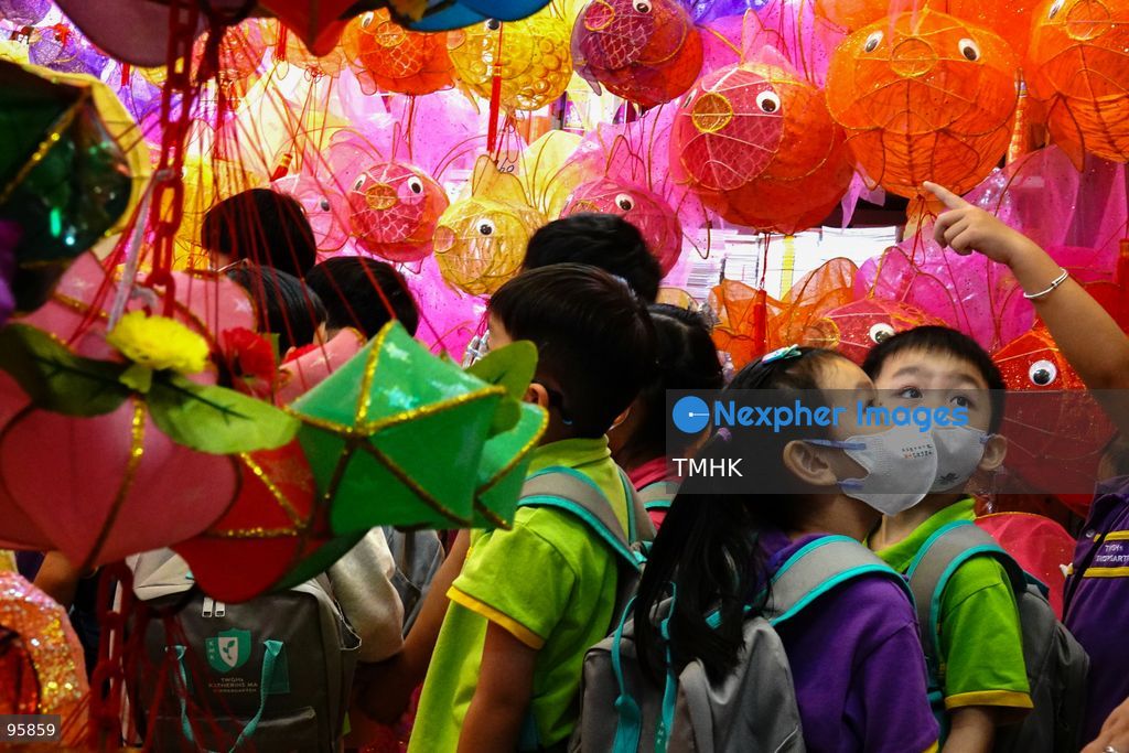 Children look up in delight at a ceiling filled with traditional handmade paper lanterns and colourful plastic lanterns during a visit to an old shop on September 22, 2026 in Hong Kong, discovering classic festive customs ahead of the Mid-Autumn Festival. (Photo by Zulu Lo/TMHK via Nexpher Images)