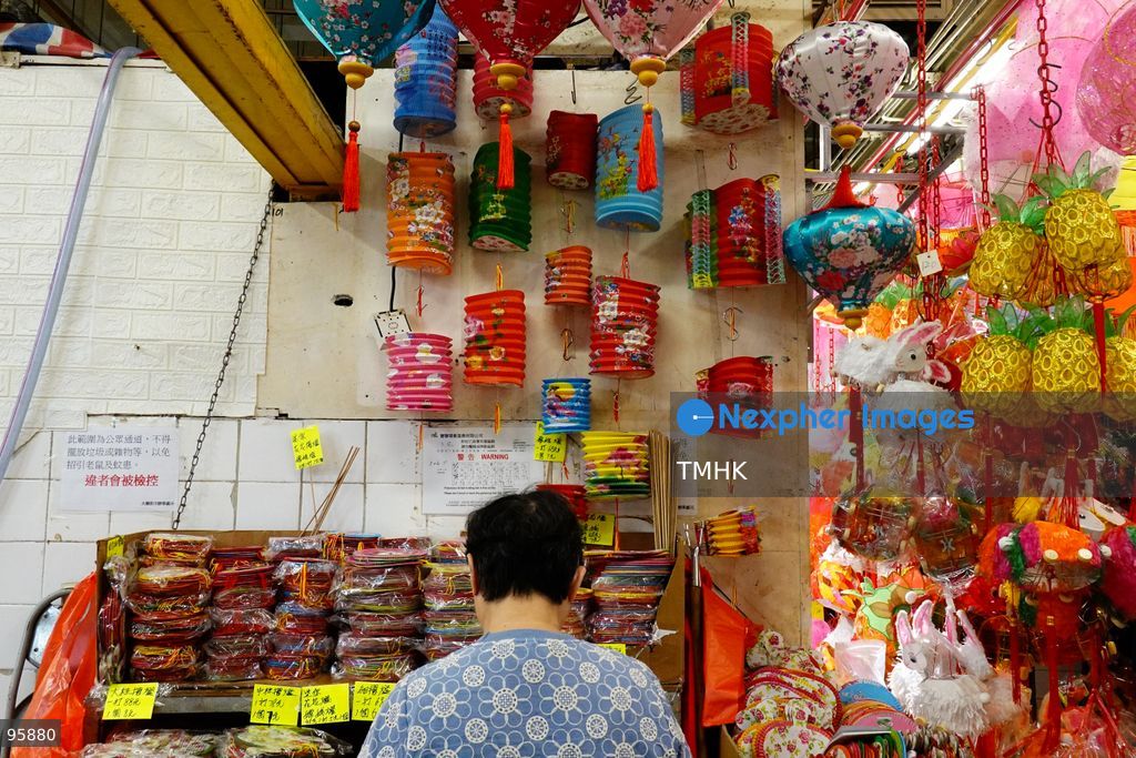 A sole shopkeeper unpacks and arranges an assortment of traditional paper lanterns and classic plastic lanterns inside his shop on September 22, 2026 in Hong Kong, stocking up ahead of the busy sales season for the Mid-Autumn Festival. (Photo by Zulu Lo/TMHK via Nexpher Images)