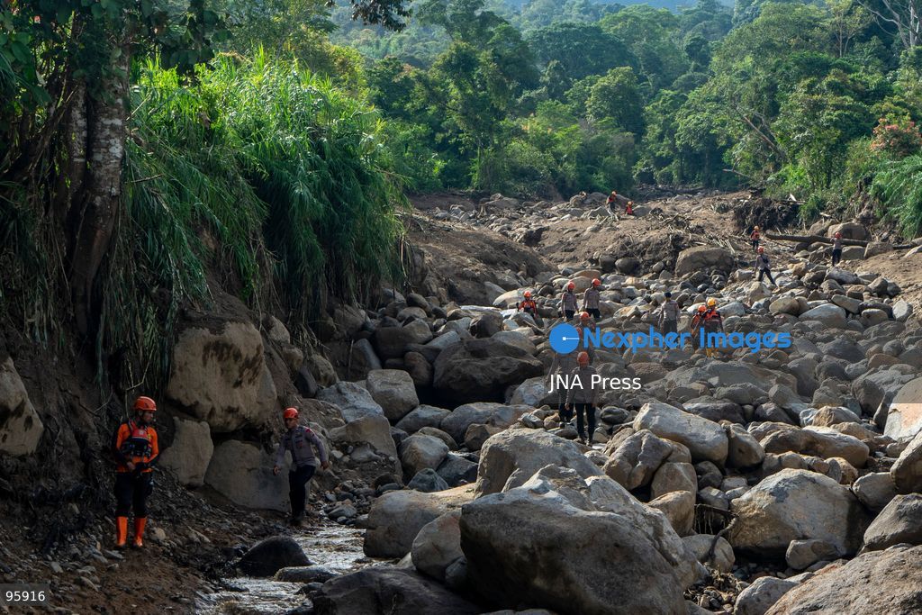 SOLOK, WEST SUMATRA, INDONESIA, SEPTEMBER 23, 2026: Members of a joint search and rescue team comb an area affected by flash flooding in Arosuka, Solok, West Sumatra, as operations continue to locate a missing resident. Search teams from Indonesia’s National Search and Rescue Agency (BASARNAS), working alongside local residents, are searching for 59-year-old Agusral, who was reported missing after being swept away by floodwaters on September 21. Search efforts focused on several locations along the path of flood debris and a nearby river. Photo by Wawan Kurniawan / JNA Press. (Photo by Wawan Kurniawan/JNA Press via Nexpher Images)
