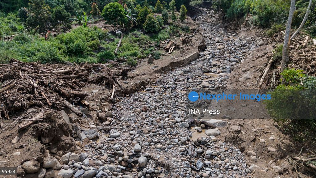 SOLOK, WEST SUMATRA, INDONESIA, SEPTEMBER 23, 2026: Members of a joint search and rescue team comb an area affected by flash flooding in Arosuka, Solok, West Sumatra, as operations continue to locate a missing resident. Search teams from Indonesia’s National Search and Rescue Agency (BASARNAS), working alongside local residents, are searching for 59-year-old Agusral, who was reported missing after being swept away by floodwaters on September 21. Search efforts focused on several locations along the path of flood debris and a nearby river. Photo by Wawan Kurniawan / JNA Press. (Photo by Wawan Kurniawan/JNA Press via Nexpher Images)