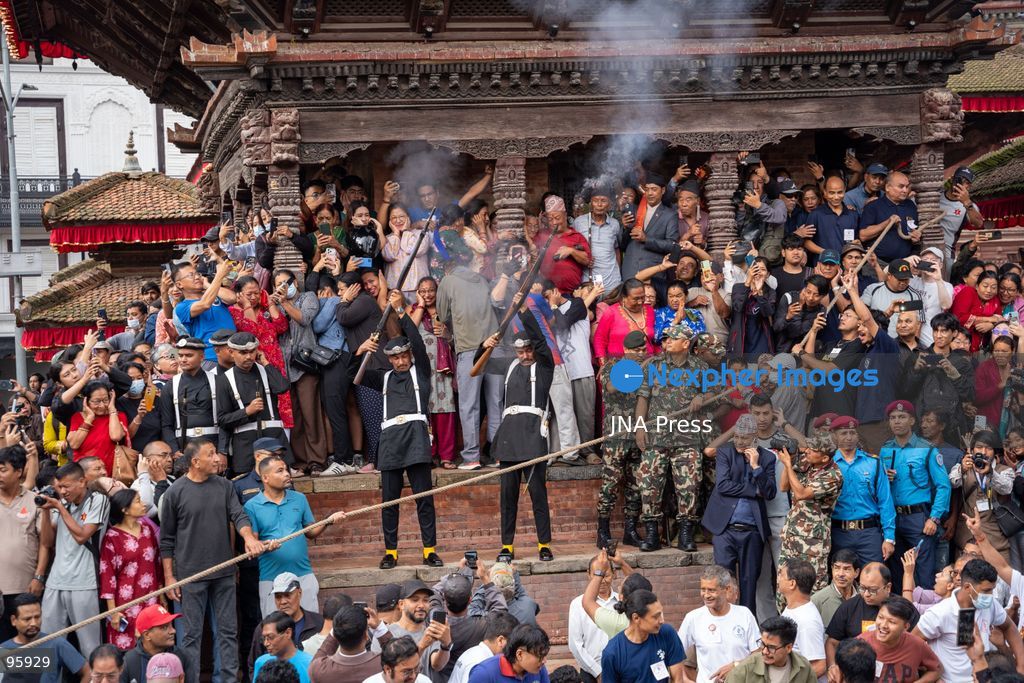 KATHMANDU, NEPAL, SEPTEMBER 23, 2026: Participants raise the ceremonial Indra Dhwaja, or flagpole, in front of Hanuman Dhoka at Basantapur in Kathmandu, formally marking the beginning of the annual Indra Jatra festival. The eight-day religious and cultural festival features traditional rituals, masked dances, chariot processions and worship of Hindu deities, and is one of the major annual celebrations of the Kathmandu Valley. Photo by Ghanashyam Shrestha / JNA Press. (Photo by Ghanashyam Shrestha/JNA Press via Nexpher Images)