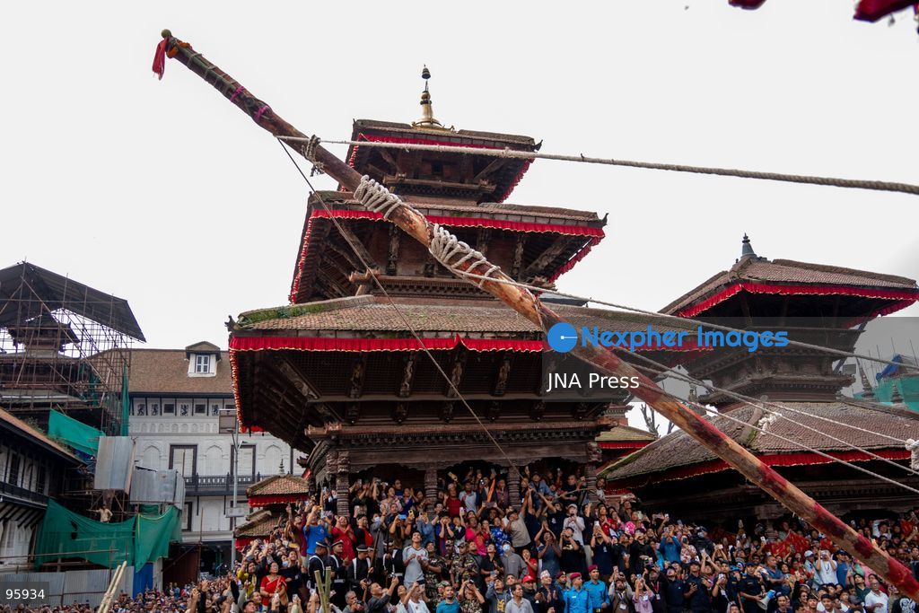KATHMANDU, NEPAL, SEPTEMBER 23, 2026: Participants raise the ceremonial Indra Dhwaja, or flagpole, in front of Hanuman Dhoka at Basantapur in Kathmandu, formally marking the beginning of the annual Indra Jatra festival. The eight-day religious and cultural festival features traditional rituals, masked dances, chariot processions and worship of Hindu deities, and is one of the major annual celebrations of the Kathmandu Valley. Photo by Ghanashyam Shrestha / JNA Press. (Photo by Ghanashyam Shrestha/JNA Press via Nexpher Images)