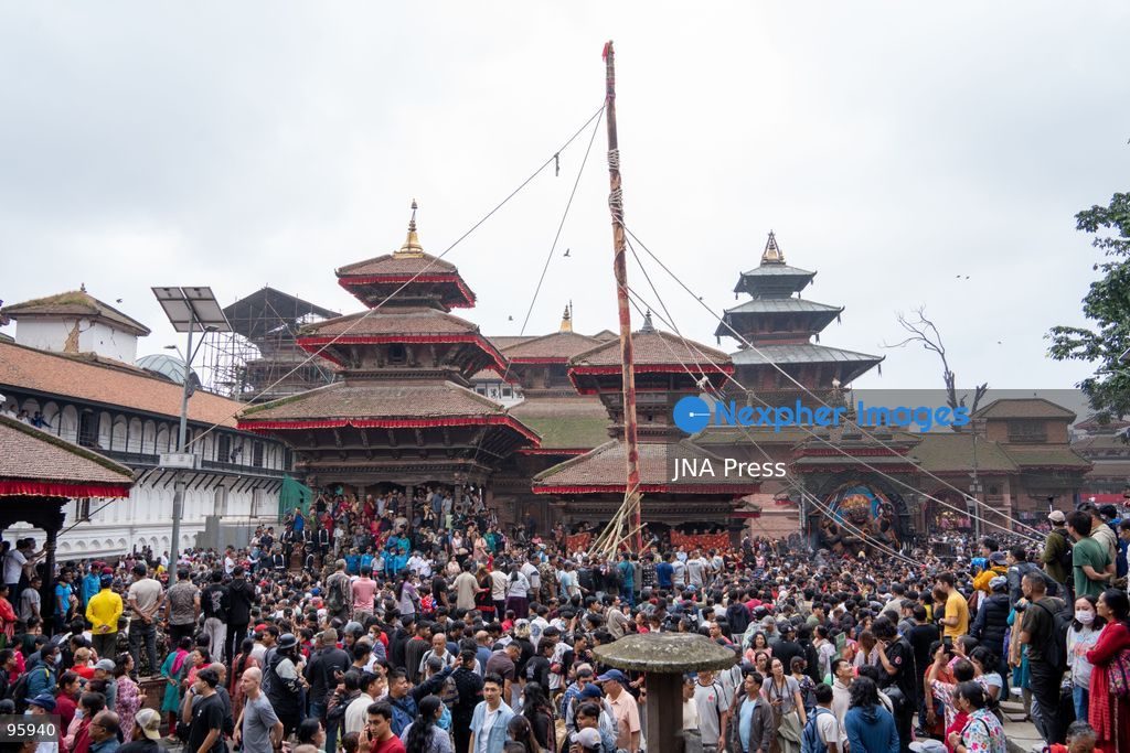KATHMANDU, NEPAL, SEPTEMBER 23, 2026: Participants raise the ceremonial Indra Dhwaja, or flagpole, in front of Hanuman Dhoka at Basantapur in Kathmandu, formally marking the beginning of the annual Indra Jatra festival. The eight-day religious and cultural festival features traditional rituals, masked dances, chariot processions and worship of Hindu deities, and is one of the major annual celebrations of the Kathmandu Valley. Photo by Ghanashyam Shrestha / JNA Press. (Photo by Ghanashyam Shrestha/JNA Press via Nexpher Images)