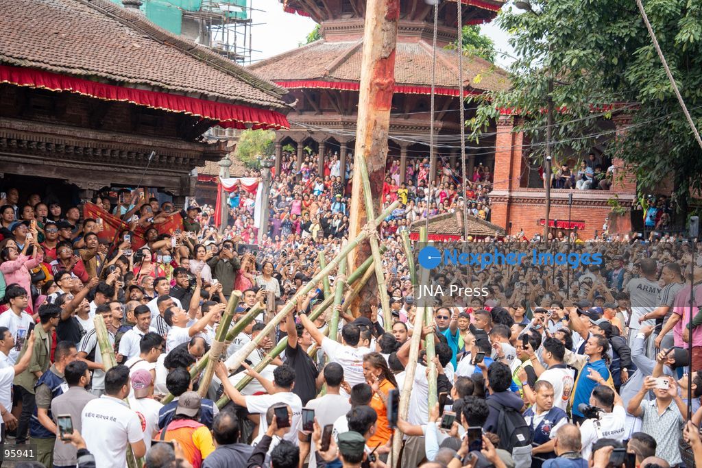 KATHMANDU, NEPAL, SEPTEMBER 23, 2026: Participants raise the ceremonial Indra Dhwaja, or flagpole, in front of Hanuman Dhoka at Basantapur in Kathmandu, formally marking the beginning of the annual Indra Jatra festival. The eight-day religious and cultural festival features traditional rituals, masked dances, chariot processions and worship of Hindu deities, and is one of the major annual celebrations of the Kathmandu Valley. Photo by Ghanashyam Shrestha / JNA Press. (Photo by Ghanashyam Shrestha/JNA Press via Nexpher Images)