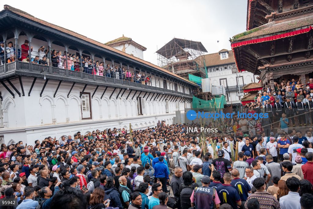 KATHMANDU, NEPAL, SEPTEMBER 23, 2026: Participants raise the ceremonial Indra Dhwaja, or flagpole, in front of Hanuman Dhoka at Basantapur in Kathmandu, formally marking the beginning of the annual Indra Jatra festival. The eight-day religious and cultural festival features traditional rituals, masked dances, chariot processions and worship of Hindu deities, and is one of the major annual celebrations of the Kathmandu Valley. Photo by Ghanashyam Shrestha / JNA Press. (Photo by Ghanashyam Shrestha/JNA Press via Nexpher Images)