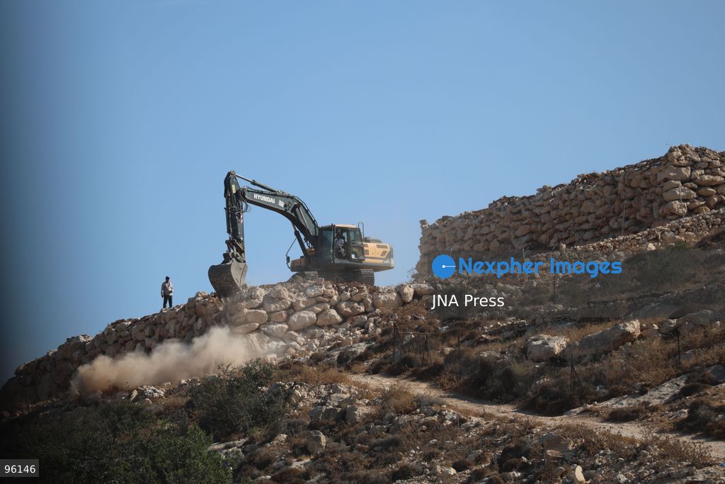DURA, HEBRON, OCCUPIED WEST BANK, SEPTEMBER 24, 2026: Israeli forces use heavy machinery to bulldoze agricultural land in the Hamseh area near Dura, south of Hebron. The operation caused damage to farmland as Israeli forces continued earthworks in the area. Hamseh has been subjected to repeated bulldozing and demolition operations in recent weeks. Photo by Mosab Shawer / JNA Press. (Photo by Mosab shawer/JNA Press via Nexpher Images)