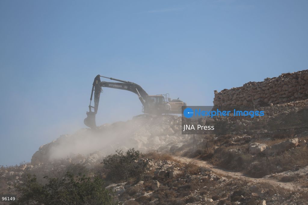 DURA, HEBRON, OCCUPIED WEST BANK, SEPTEMBER 24, 2026: Israeli forces use heavy machinery to bulldoze agricultural land in the Hamseh area near Dura, south of Hebron. The operation caused damage to farmland as Israeli forces continued earthworks in the area. Hamseh has been subjected to repeated bulldozing and demolition operations in recent weeks. Photo by Mosab Shawer / JNA Press. (Photo by Mosab shawer/JNA Press via Nexpher Images)
