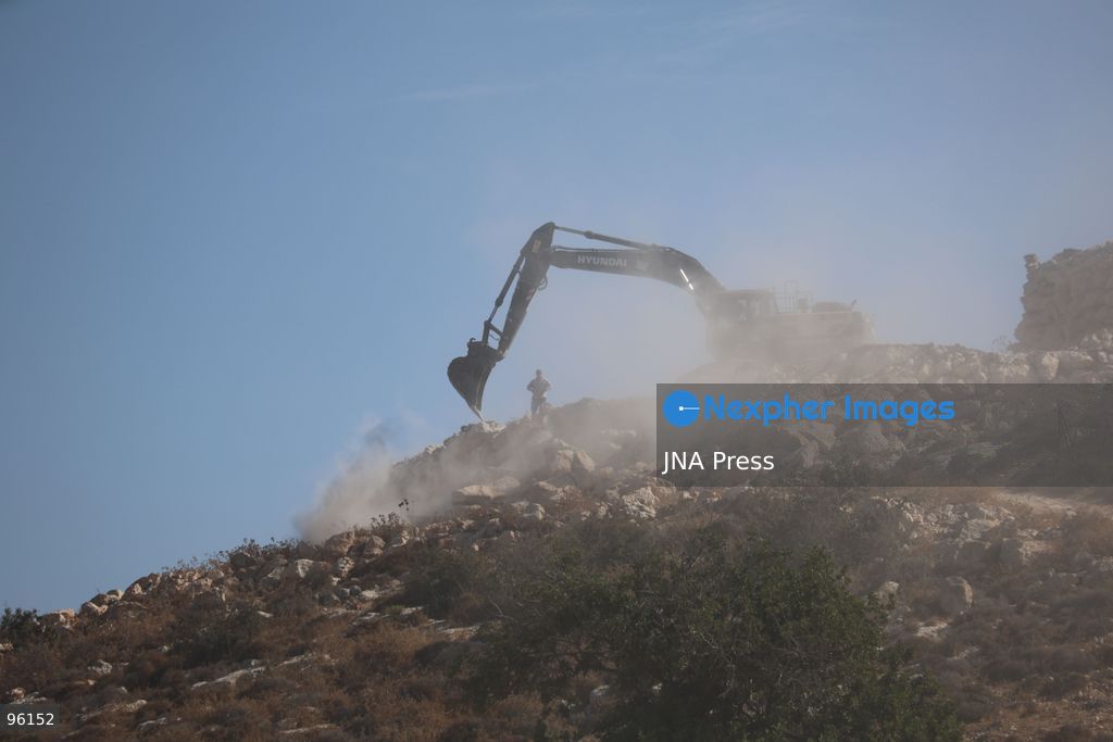 DURA, HEBRON, OCCUPIED WEST BANK, SEPTEMBER 24, 2026: Israeli forces use heavy machinery to bulldoze agricultural land in the Hamseh area near Dura, south of Hebron. The operation caused damage to farmland as Israeli forces continued earthworks in the area. Hamseh has been subjected to repeated bulldozing and demolition operations in recent weeks. Photo by Mosab Shawer / JNA Press. (Photo by Mosab shawer/JNA Press via Nexpher Images)