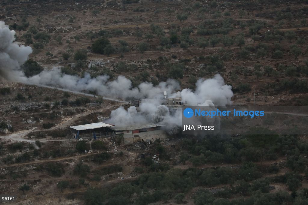 BEIT IMRIN, NABLUS, OCCUPIED WEST BANK, SEPTEMBER 24, 2026: Smoke rises after Israeli forces blew up the family home of Palestinian prisoner Dawas Hassoun in the village of Beit Imrin, northwest of Nablus. Israeli authorities accuse Hassoun, who has been detained since March, of carrying out a vehicle-ramming attack on March 21 that killed Israeli settler Yehuda Sherman. Residents were ordered to evacuate the house before the demolition, which also caused damage to neighboring property, according to local sources. Photo by Nedal Shtieh / JNA Press. (Photo by Nedal Shtieh/JNA Press via Nexpher Images)