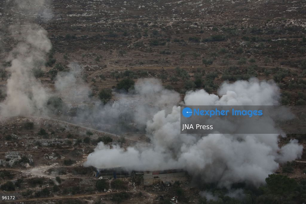BEIT IMRIN, NABLUS, OCCUPIED WEST BANK, SEPTEMBER 24, 2026: Smoke rises after Israeli forces blew up the family home of Palestinian prisoner Dawas Hassoun in the village of Beit Imrin, northwest of Nablus. Israeli authorities accuse Hassoun, who has been detained since March, of carrying out a vehicle-ramming attack on March 21 that killed Israeli settler Yehuda Sherman. Residents were ordered to evacuate the house before the demolition, which also caused damage to neighboring property, according to local sources. Photo by Nedal Shtieh / JNA Press. (Photo by Nedal Shtieh/JNA Press via Nexpher Images)