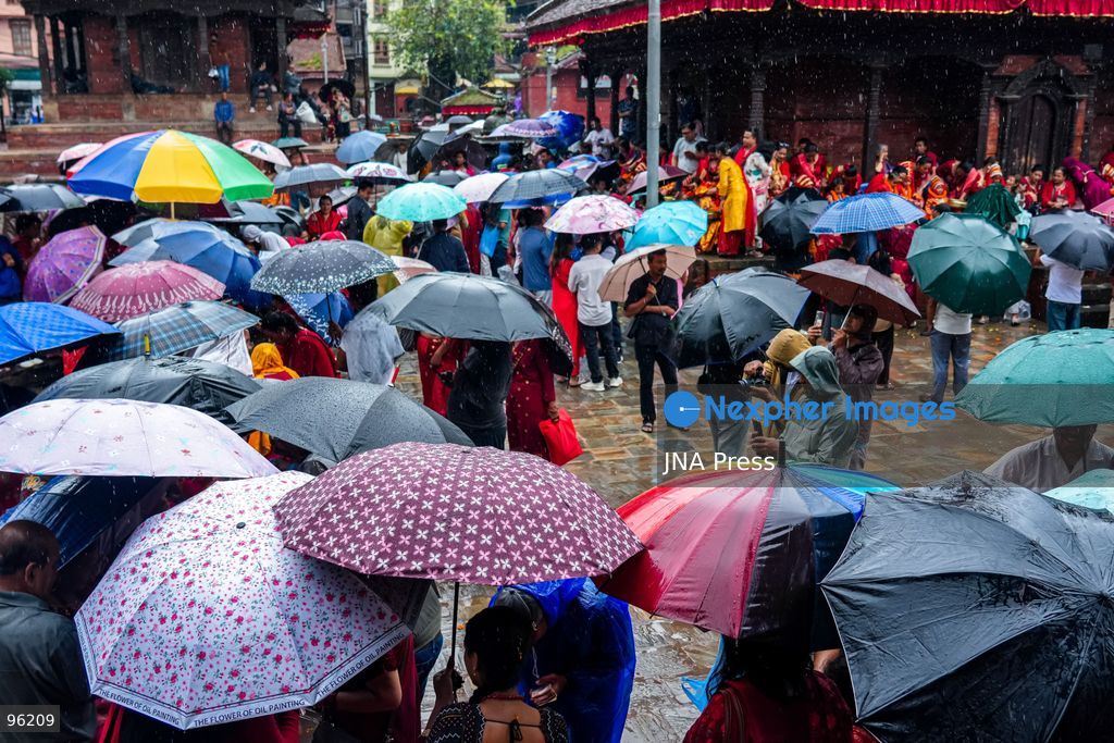 KATHMANDU, NEPAL, SEPTEMBER 24, 2026: People make their way through rainfall in Kathmandu as wet weather affects the Nepalese capital. Active monsoon conditions have brought increased cloud cover and rainfall across parts of Nepal. Photo by Ambir Tolang / JNA Press. (Photo by Ambir Tolang/JNA Press via Nexpher Images)