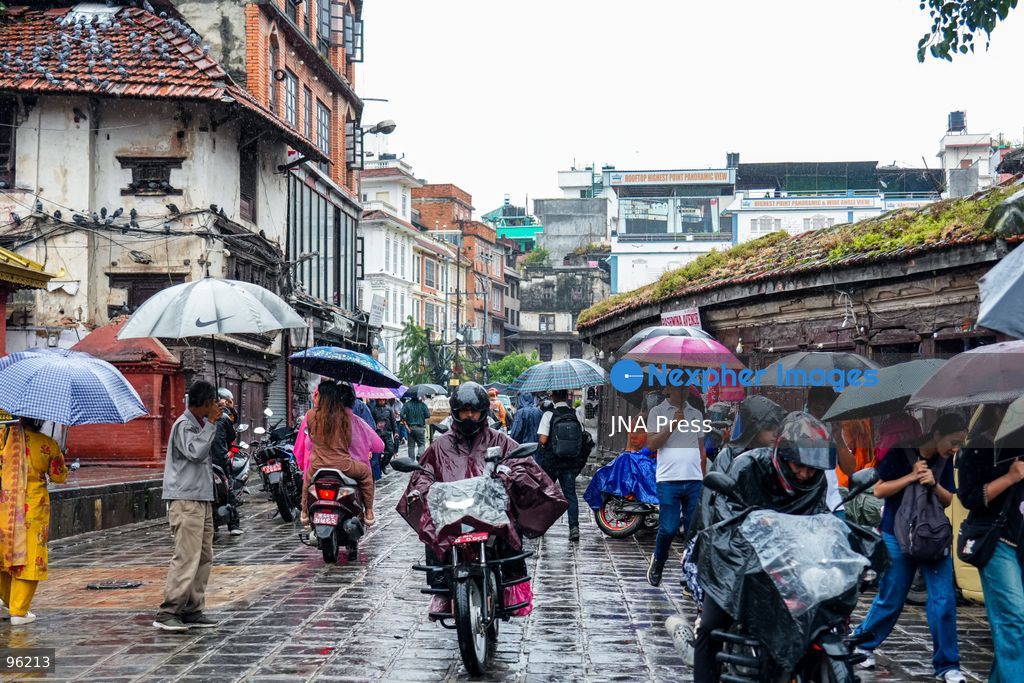 KATHMANDU, NEPAL, SEPTEMBER 24, 2026: People make their way through rainfall in Kathmandu as wet weather affects the Nepalese capital. Active monsoon conditions have brought increased cloud cover and rainfall across parts of Nepal. Photo by Ambir Tolang / JNA Press. (Photo by Ambir Tolang/JNA Press via Nexpher Images)