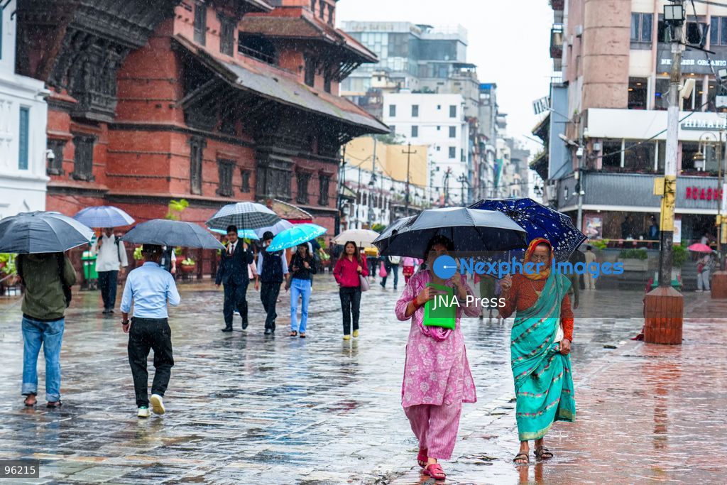 KATHMANDU, NEPAL, SEPTEMBER 24, 2026: People make their way through rainfall in Kathmandu as wet weather affects the Nepalese capital. Active monsoon conditions have brought increased cloud cover and rainfall across parts of Nepal. Photo by Ambir Tolang / JNA Press. (Photo by Ambir Tolang/JNA Press via Nexpher Images)