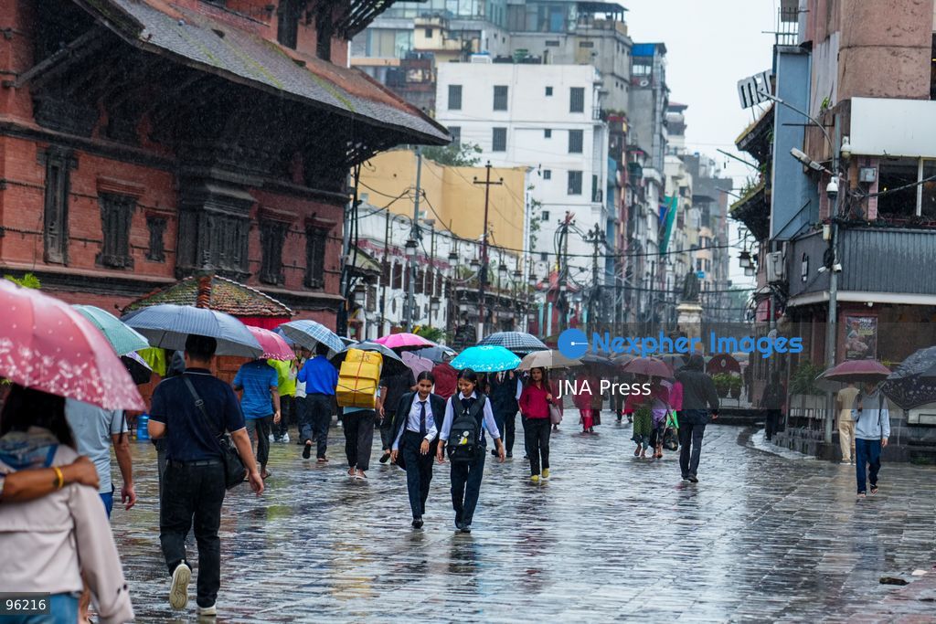 KATHMANDU, NEPAL, SEPTEMBER 24, 2026: People make their way through rainfall in Kathmandu as wet weather affects the Nepalese capital. Active monsoon conditions have brought increased cloud cover and rainfall across parts of Nepal. Photo by Ambir Tolang / JNA Press. (Photo by Ambir Tolang/JNA Press via Nexpher Images)