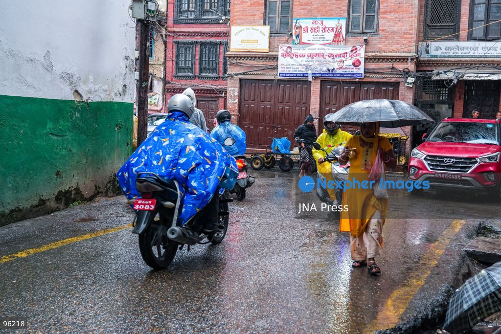 KATHMANDU, NEPAL, SEPTEMBER 24, 2026: People make their way through rainfall in Kathmandu as wet weather affects the Nepalese capital. Active monsoon conditions have brought increased cloud cover and rainfall across parts of Nepal. Photo by Ambir Tolang / JNA Press. (Photo by Ambir Tolang/JNA Press via Nexpher Images)