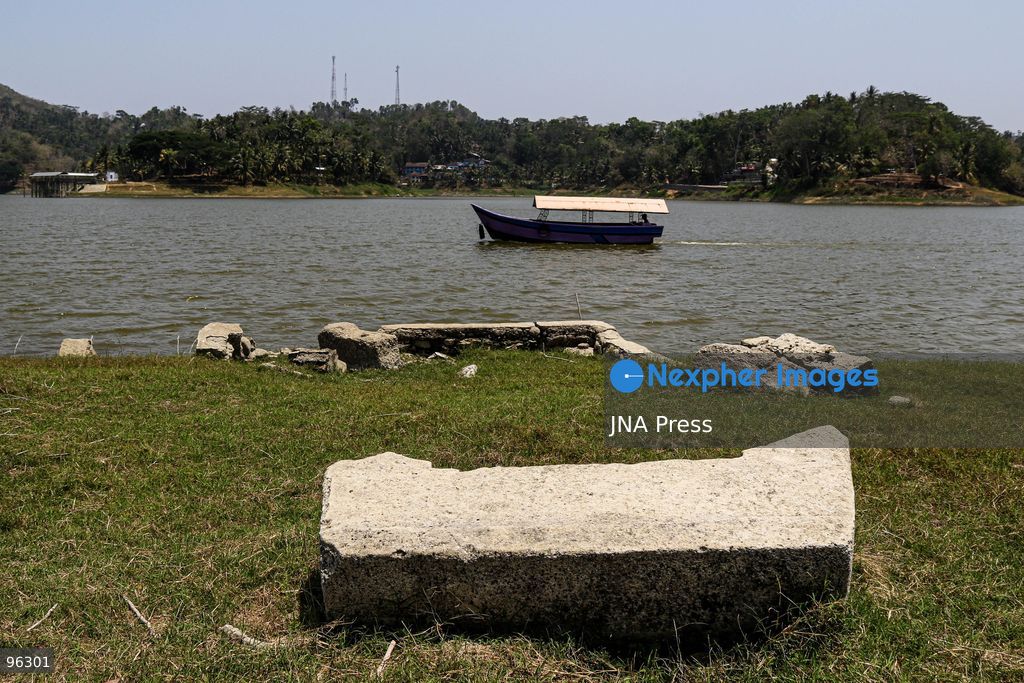 KULON PROGO, YOGYAKARTA, INDONESIA, SEPTEMBER 24, 2026: An old cemetery complex emerges as water levels recede at the Sermo Reservoir in Kulon Progo, Yogyakarta. The cemetery was among areas affected during construction of the reservoir between 1994 and 1996. Reservoir authorities said the lower water level has not disrupted operations or community water supplies, with the reservoir holding approximately 15 million cubic meters of water. Photo by Ilham Nur Arifin / JNA Press. (Photo by Ilham Nur Arifin/JNA Press via Nexpher Images)