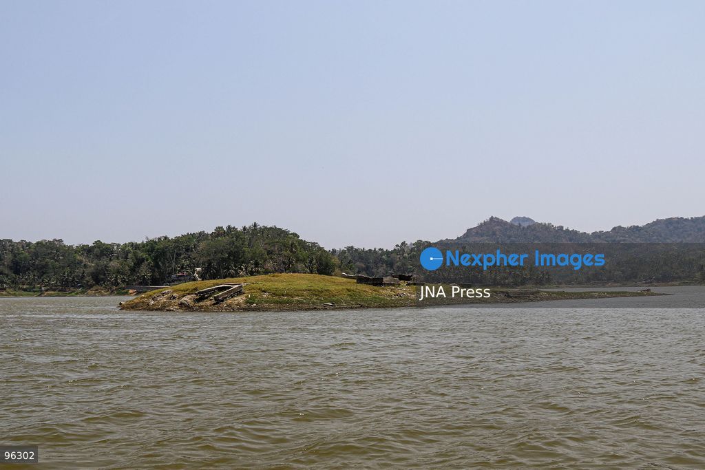 KULON PROGO, YOGYAKARTA, INDONESIA, SEPTEMBER 24, 2026: An old cemetery complex emerges as water levels recede at the Sermo Reservoir in Kulon Progo, Yogyakarta. The cemetery was among areas affected during construction of the reservoir between 1994 and 1996. Reservoir authorities said the lower water level has not disrupted operations or community water supplies, with the reservoir holding approximately 15 million cubic meters of water. Photo by Ilham Nur Arifin / JNA Press. (Photo by Ilham Nur Arifin/JNA Press via Nexpher Images)