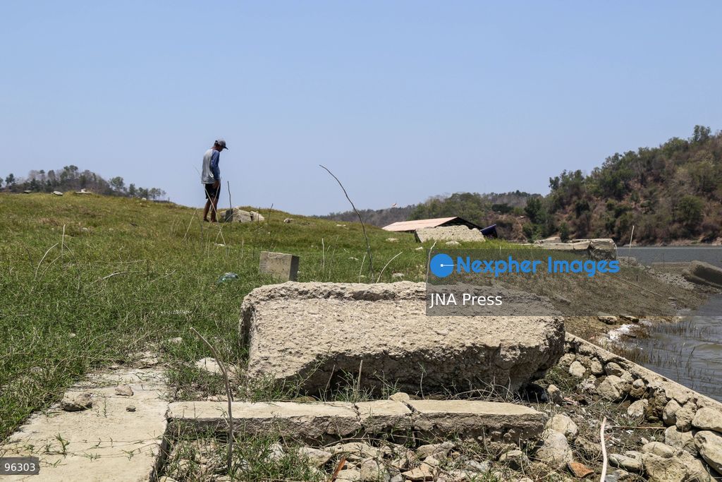 KULON PROGO, YOGYAKARTA, INDONESIA, SEPTEMBER 24, 2026: An old cemetery complex emerges as water levels recede at the Sermo Reservoir in Kulon Progo, Yogyakarta. The cemetery was among areas affected during construction of the reservoir between 1994 and 1996. Reservoir authorities said the lower water level has not disrupted operations or community water supplies, with the reservoir holding approximately 15 million cubic meters of water. Photo by Ilham Nur Arifin / JNA Press. (Photo by Ilham Nur Arifin/JNA Press via Nexpher Images)