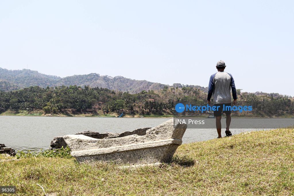 KULON PROGO, YOGYAKARTA, INDONESIA, SEPTEMBER 24, 2026: An old cemetery complex emerges as water levels recede at the Sermo Reservoir in Kulon Progo, Yogyakarta. The cemetery was among areas affected during construction of the reservoir between 1994 and 1996. Reservoir authorities said the lower water level has not disrupted operations or community water supplies, with the reservoir holding approximately 15 million cubic meters of water. Photo by Ilham Nur Arifin / JNA Press. (Photo by Ilham Nur Arifin/JNA Press via Nexpher Images)