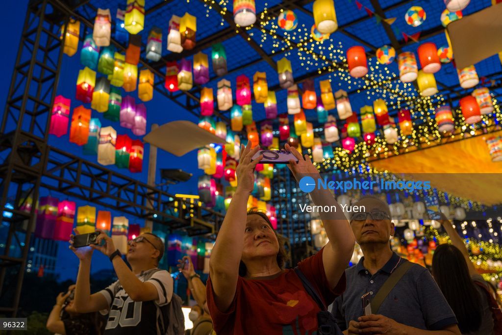People taking photos of the mid autumn festival lights at Victoria Park on September 24, 2026 in Hong Kong. (Photo by Vernon Yuen/Nexpher Images)