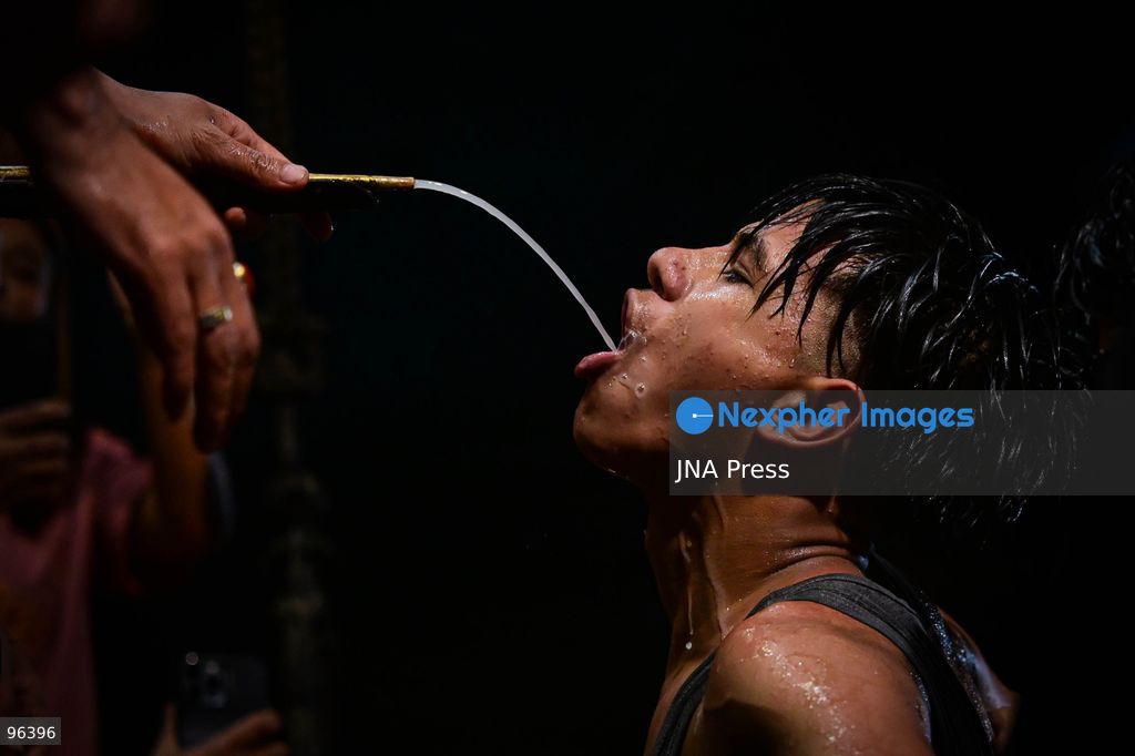 KATHMANDU, NEPAL, SEPTEMBER 24, 2026: Revelers gather around the Swet Bhairab mask to receive rice beer flowing through a brass spout from the deity’s mouth during the second day of the Indra Jatra festival at Kathmandu Durbar Square. The drink is traditionally regarded as a blessing by devotees. Swet Bhairab, a representation of the Hindu deity Bhairava, is displayed publicly during the annual festival and remains covered for much of the rest of the year. Indra Jatra is an eight-day religious and cultural festival featuring processions, masked dances and traditional rituals in Kathmandu. Photo by Safal Prakash Shrestha / JNA Press. (Photo by Safal Prakash Shrestha/JNA Press via Nexpher Images)