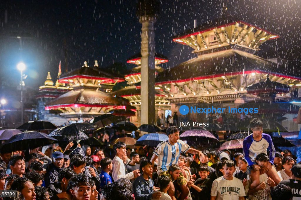 KATHMANDU, NEPAL, SEPTEMBER 24, 2026: Revelers gather around the Swet Bhairab mask to receive rice beer flowing through a brass spout from the deity’s mouth during the second day of the Indra Jatra festival at Kathmandu Durbar Square. The drink is traditionally regarded as a blessing by devotees. Swet Bhairab, a representation of the Hindu deity Bhairava, is displayed publicly during the annual festival and remains covered for much of the rest of the year. Indra Jatra is an eight-day religious and cultural festival featuring processions, masked dances and traditional rituals in Kathmandu. Photo by Safal Prakash Shrestha / JNA Press. (Photo by Safal Prakash Shrestha/JNA Press via Nexpher Images)