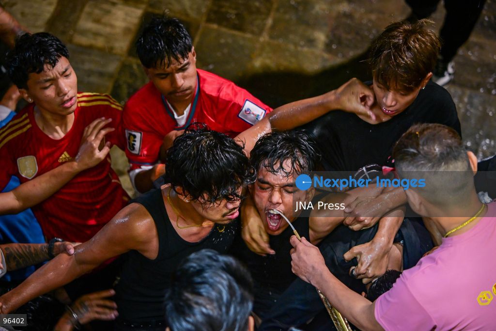 KATHMANDU, NEPAL, SEPTEMBER 24, 2026: Revelers gather around the Swet Bhairab mask to receive rice beer flowing through a brass spout from the deity’s mouth during the second day of the Indra Jatra festival at Kathmandu Durbar Square. The drink is traditionally regarded as a blessing by devotees. Swet Bhairab, a representation of the Hindu deity Bhairava, is displayed publicly during the annual festival and remains covered for much of the rest of the year. Indra Jatra is an eight-day religious and cultural festival featuring processions, masked dances and traditional rituals in Kathmandu. Photo by Safal Prakash Shrestha / JNA Press. (Photo by Safal Prakash Shrestha/JNA Press via Nexpher Images)